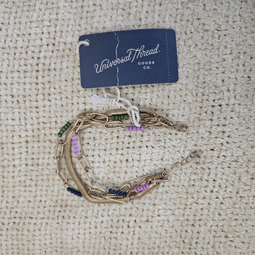 Multi strand goldtone and beads bracelet.